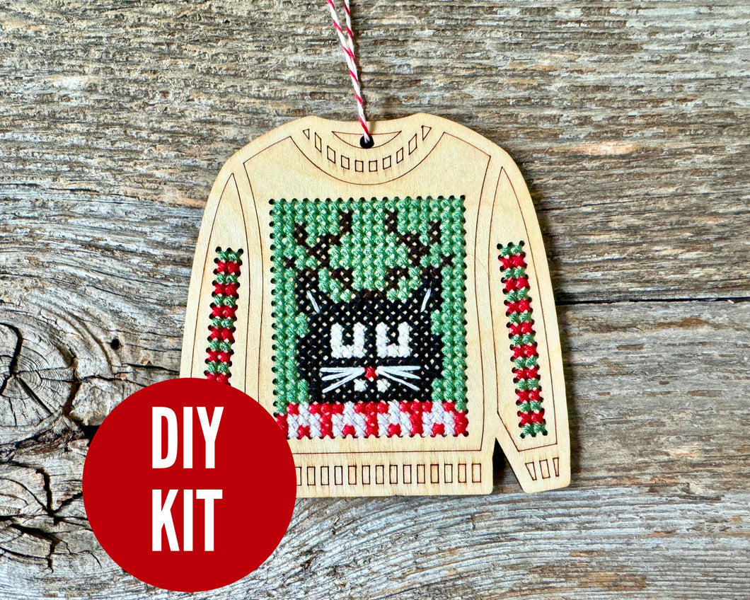 Clarence cat ugly sweater cross stitch kit