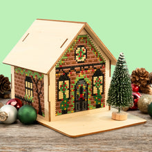 Load image into Gallery viewer, A stitched wooden house sitting on a table

