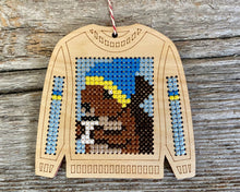 Load image into Gallery viewer, Tree ornament cross stitch on wood featuring squirrel drinking coffee on ugly Christmas sweater FREE SHIPPING
