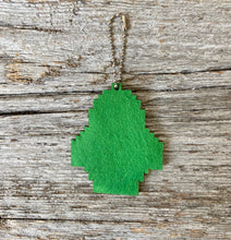 Load image into Gallery viewer, Back of chick ornament shown covered with green adhesive felt that is included in package
